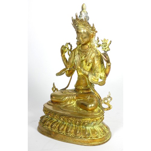 221 - A Tibetan Buddhist deity Chenrezig brass statue, 33cm,