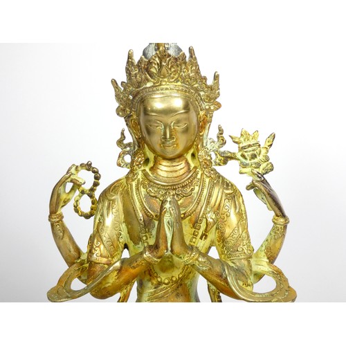 221 - A Tibetan Buddhist deity Chenrezig brass statue, 33cm,