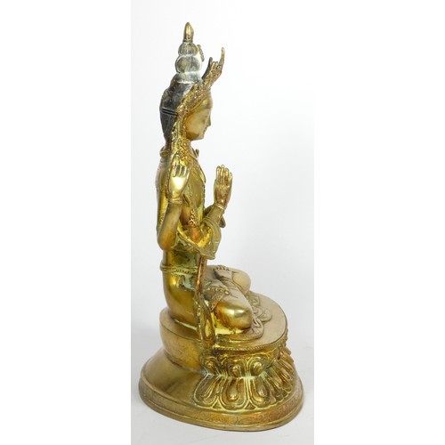 221 - A Tibetan Buddhist deity Chenrezig brass statue, 33cm,