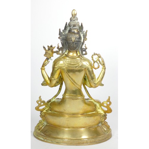 221 - A Tibetan Buddhist deity Chenrezig brass statue, 33cm,