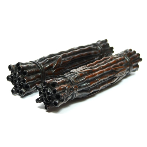 227 - A Chinese pair of hardwood scroll weights, in the form of tied bamboo rods, 24cm.