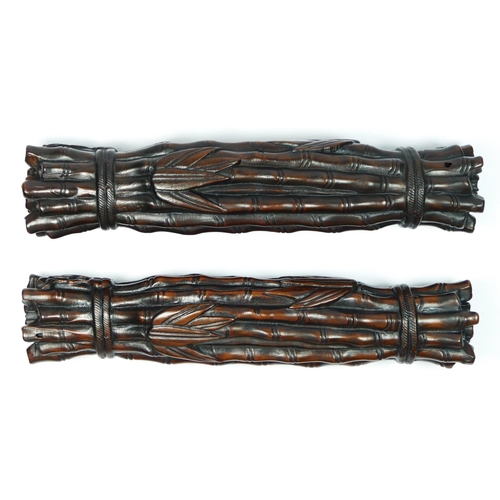 227 - A Chinese pair of hardwood scroll weights, in the form of tied bamboo rods, 24cm.