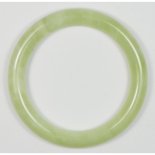 231 - A jadeite bangle, untested for colour, internal diameter 64mm.