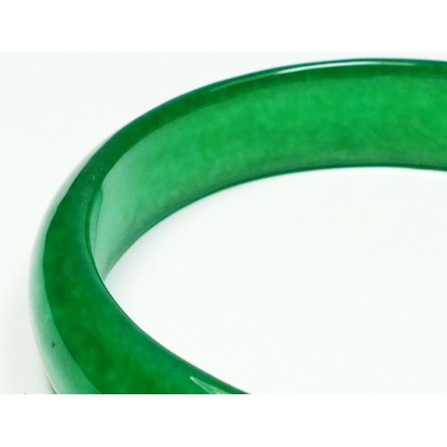 232 - A jadeite bangle, untested for colour, internal diameter 60mm.