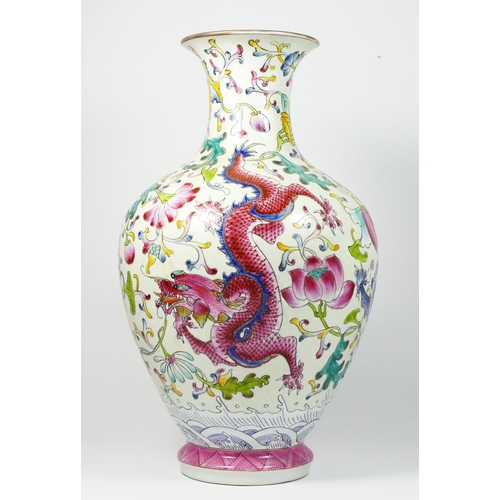 233 - A Chinese famile rouge baluster vase, with blue and pink dragon decoration, 35cm