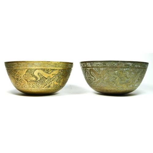 247 - A Chinese brass bowl with dragon and crane decoration, signed to the base, 24.5cm and another simila... 