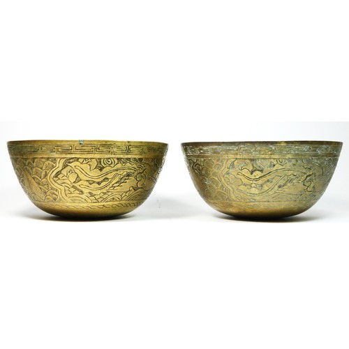 247 - A Chinese brass bowl with dragon and crane decoration, signed to the base, 24.5cm and another simila... 