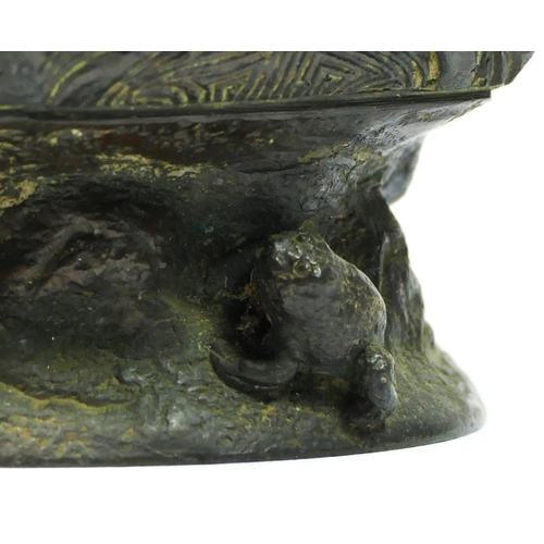 249 - A Chinese bronze octagonal baluster storage jar, with frog finial, 18cm.