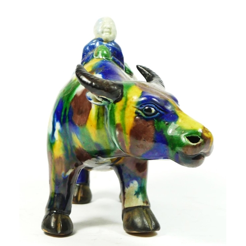 254 - A Chinese Sancai glazed figure of a water buffalo and boy, 20cm