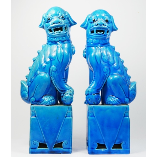 255 - A Chinese Sancai glazed pair of Dog of Fo figures, 25cm a turquoise glazed pair, 31.5cm and a pair o... 