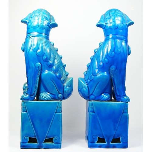 255 - A Chinese Sancai glazed pair of Dog of Fo figures, 25cm a turquoise glazed pair, 31.5cm and a pair o... 