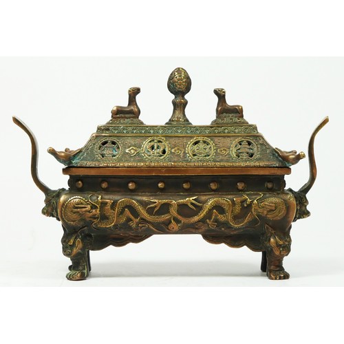 261 - A Chinese bronze censor with dragon motifs, 20 x 14 x 6cm.