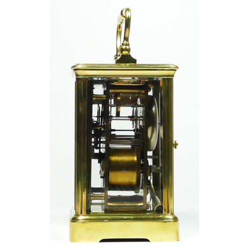 273 - An early 20th century brass striking carriage clock, white enamel dial with Roman numerals, the move... 