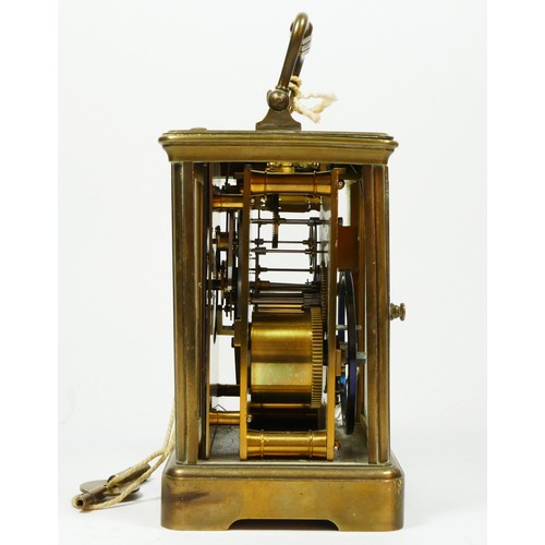 274 - T. Martin & Co., London & Paris, a late 19th century brass striking carriage clock, the white enamel... 