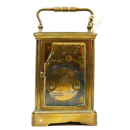 274 - T. Martin & Co., London & Paris, a late 19th century brass striking carriage clock, the white enamel... 