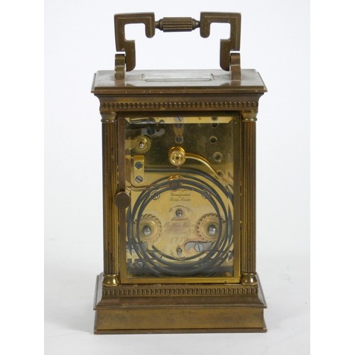 277 - Matthew Norman, London, a large brass cased alarm and striking carriage clock, the white enamel dial... 