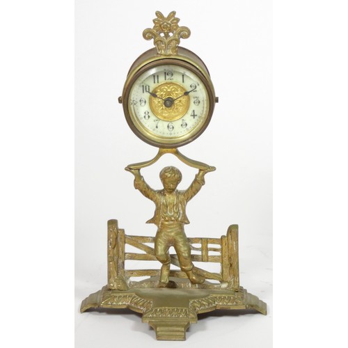 291 - The British United Clock Co. Ltd., an early 20th century brass desk time piece, in the form of a boy... 