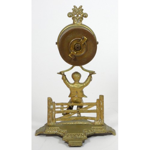 291 - The British United Clock Co. Ltd., an early 20th century brass desk time piece, in the form of a boy... 