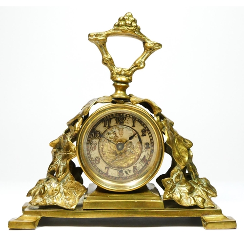 293 - The British United Clock Co. Ltd., an early 20th century brass desk time piece, the dial with a day ... 