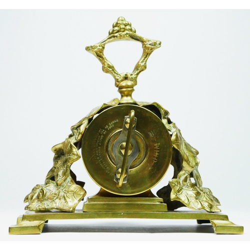 293 - The British United Clock Co. Ltd., an early 20th century brass desk time piece, the dial with a day ... 