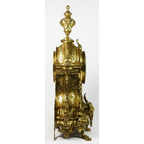 297 - A French Gilt metal ormolu striking mantel clock with garniture, late 19th century, urn shaped finia... 