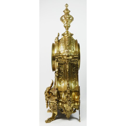 297 - A French Gilt metal ormolu striking mantel clock with garniture, late 19th century, urn shaped finia... 