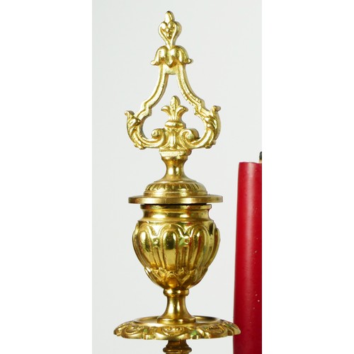 297 - A French Gilt metal ormolu striking mantel clock with garniture, late 19th century, urn shaped finia... 