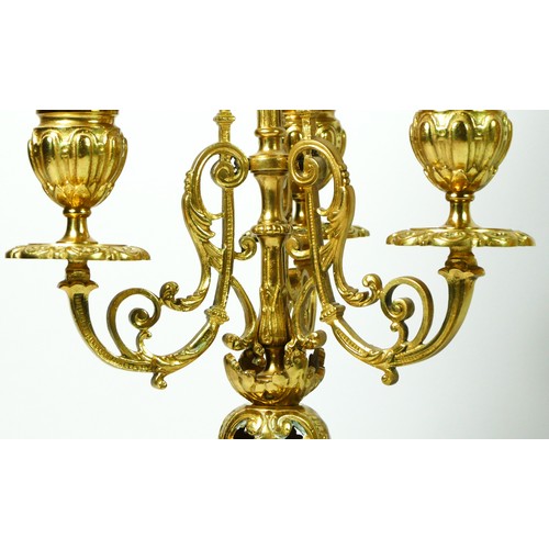 297 - A French Gilt metal ormolu striking mantel clock with garniture, late 19th century, urn shaped finia... 