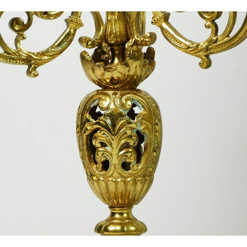 297 - A French Gilt metal ormolu striking mantel clock with garniture, late 19th century, urn shaped finia... 