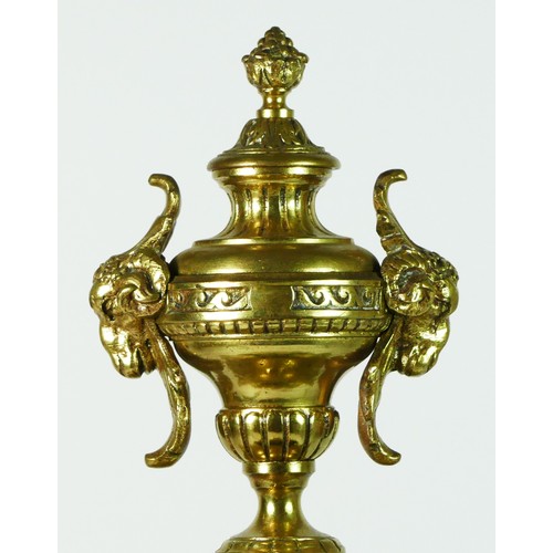 297 - A French Gilt metal ormolu striking mantel clock with garniture, late 19th century, urn shaped finia... 