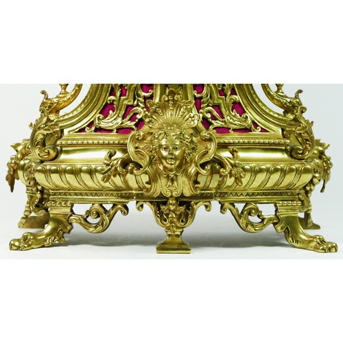 297 - A French Gilt metal ormolu striking mantel clock with garniture, late 19th century, urn shaped finia... 