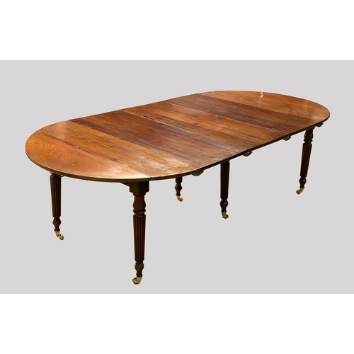 362 - A 19th Century mahogany extending dining table, with three additional leaf insertions and a pair of ... 