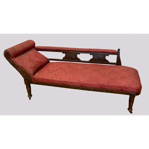 364 - An Edwardian stained beechwood framed and upholstered chaise lounge, the padded scroll end extending... 