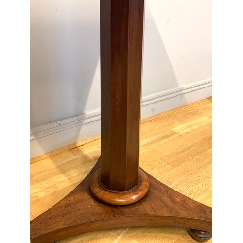 372 - A Victorian mahogany breakfast table, the rectangular, tilt-top above an octagonal column support, r... 