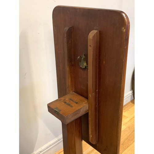 372 - A Victorian mahogany breakfast table, the rectangular, tilt-top above an octagonal column support, r... 