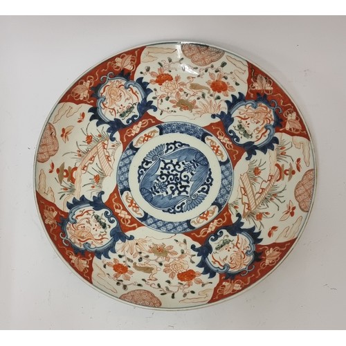 262 - A Japanese Meiji period Imari charger of typical form - 47cm diameter.