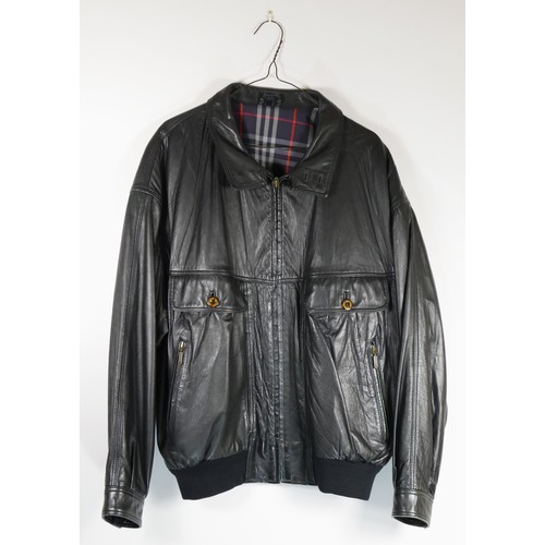 112 - A 'Burberrys' black leather bomber style jacket with zip front and side pockets and button detailing... 