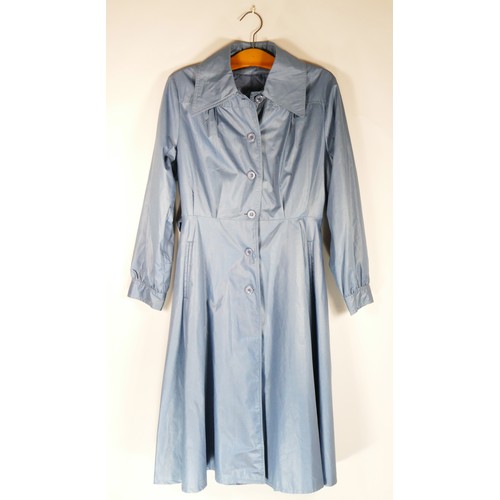 118 - A blue belted mac, quilted and lined interior, size 14, a black velvet satin trimmed cape 'volonte',... 