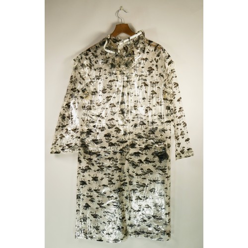 141 - A pair of raincoats including a white square patterned raincoat size 10 and a plain white 'Rainstar'... 