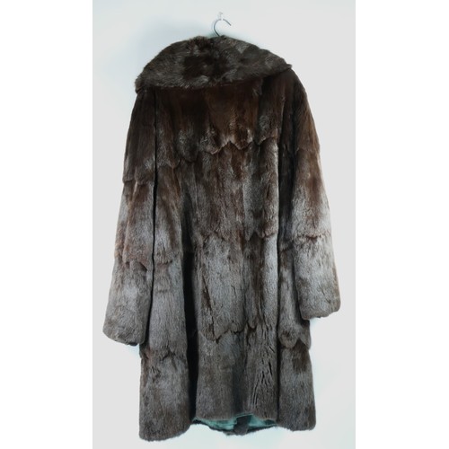 143 - A vintage dark brown fur coat in size 42