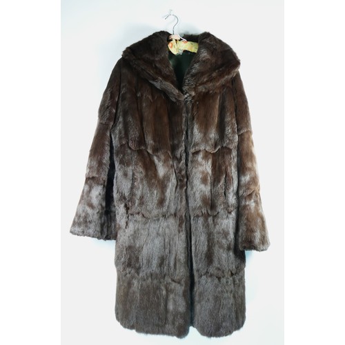 143 - A vintage dark brown fur coat in size 42