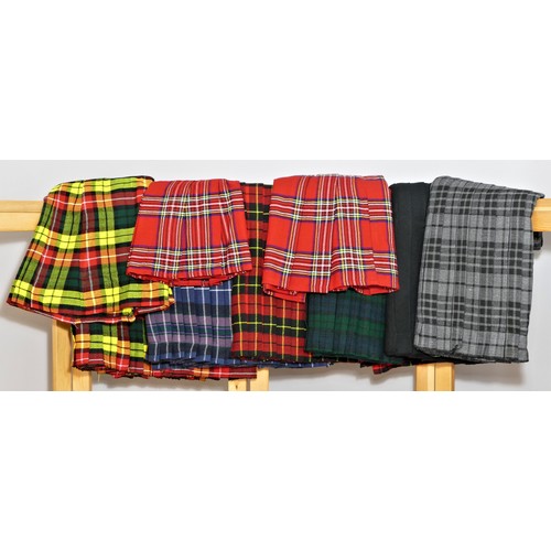 186 - Ten Scottish Highland woven tartan Kilts, unworn, various colourways, sizes 28, 32 x 5, 38, 36 x 2.