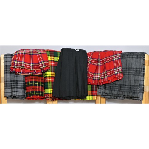187 - Nine Scottish Highland woven tartan Kilts, unworn, various colourways, sizes 32 x 2, 34 x 3, 36, 38,... 