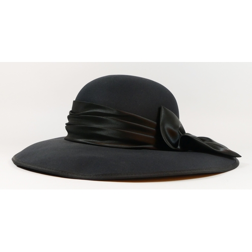 203 - A collection of vintage and modern hats, to include wedding or races brimmed hats, faux fur, two fas... 