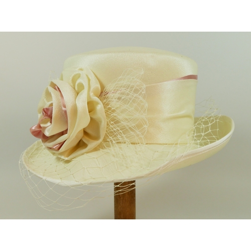 203 - A collection of vintage and modern hats, to include wedding or races brimmed hats, faux fur, two fas... 