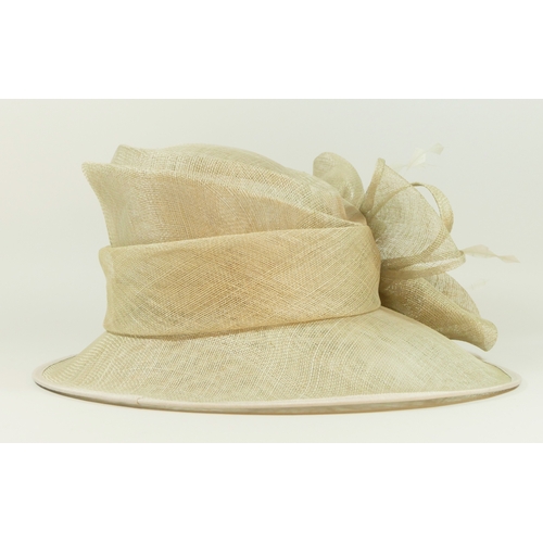 203 - A collection of vintage and modern hats, to include wedding or races brimmed hats, faux fur, two fas... 