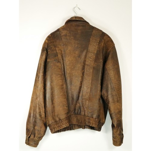 216 - A men's XL brown vintage leather bomber jacket.