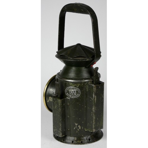 67 - A green War Dept 3 aspect handlamp, marked with W.D. broad arrow 1944, complete with burner