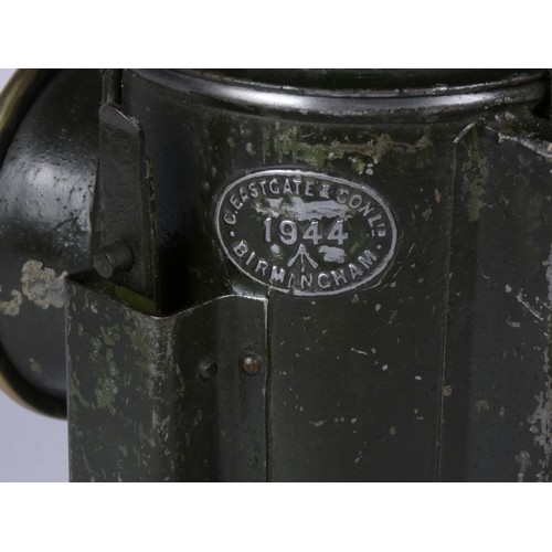 67 - A green War Dept 3 aspect handlamp, marked with W.D. broad arrow 1944, complete with burner