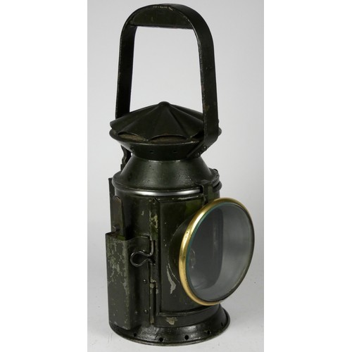 67 - A green War Dept 3 aspect handlamp, marked with W.D. broad arrow 1944, complete with burner